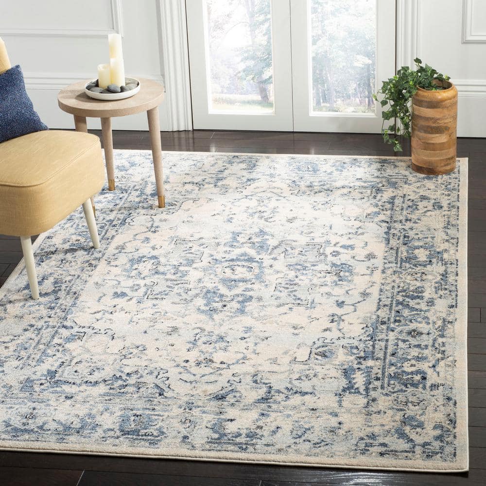 Ivory and Navy 8' x 10' Synthetic Oriental Area Rug