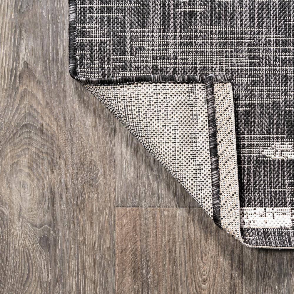 Zolak 4' x 6' Black and Ivory Synthetic Stripe Rug