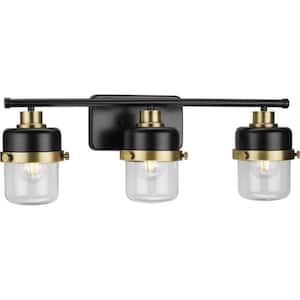 Beckner Collection 24.12 in. 3-Light Matte Black Clear Glass Urban Industrial Vanity Light with Vintage Brass Accents