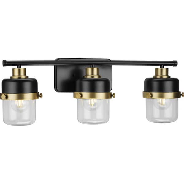 Progress Lighting Beckner Collection 24.12 in. 3-Light Matte Black Clear Glass Urban Industrial Vanity Light with Vintage Brass Accents