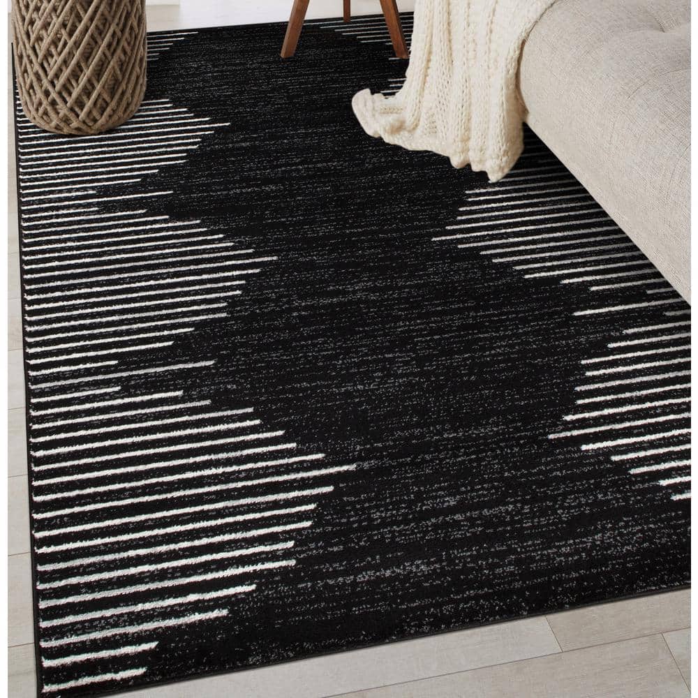 Black and White 5' x 7' Bohemian Stripe Synthetic Area Rug
