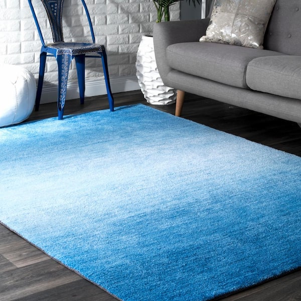 https://images.thdstatic.com/productImages/074013a8-9d39-4628-80f8-d6796e791c3b/svn/blue-nuloom-area-rugs-awve18b-860116-e1_600.jpg