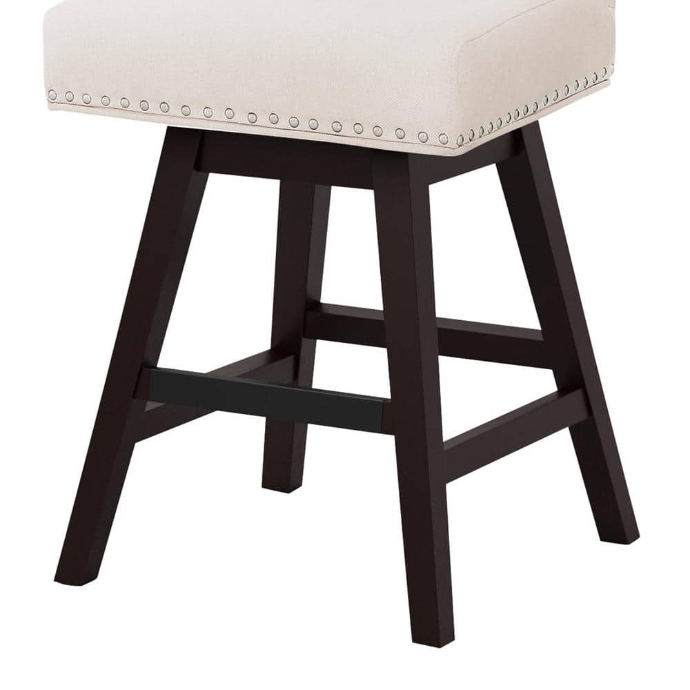 Side view of a beige linen swivel bar stool.