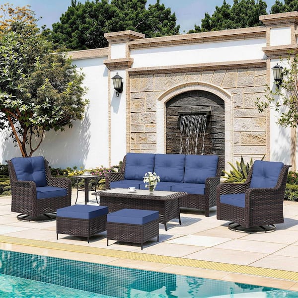 7-Piece Brown Wicker Patio Conversation Set with Swivel Rocking Chairs, Rectangular Coffee Table and Cushion Navy Blue