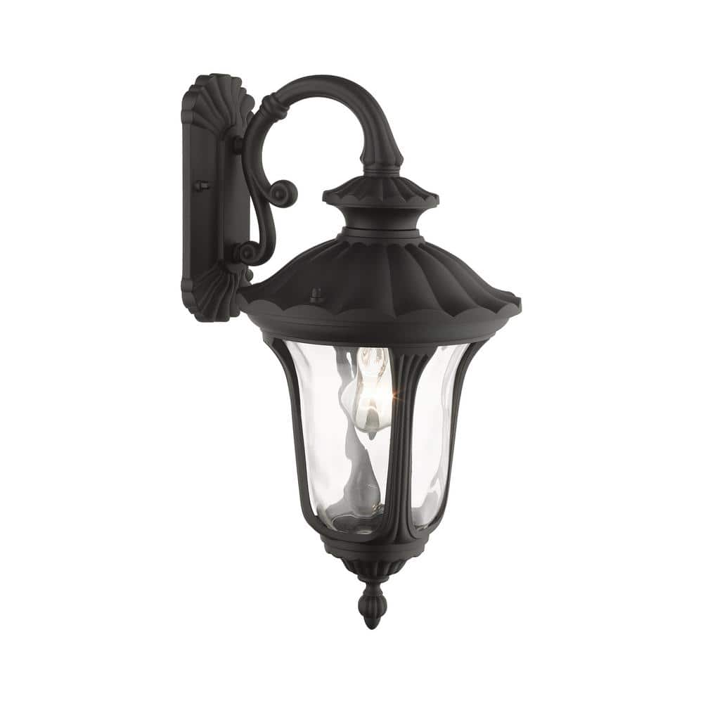 Black Textured Lantern Sconce with Clear Water Glass