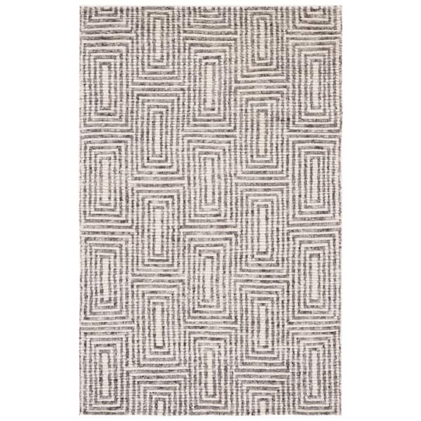 Tibetan 5 ft. x 8 ft. Black/Ivory Geometric Ornate Area Rug