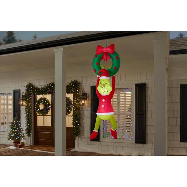 The grinch inflatables store hanging gifts