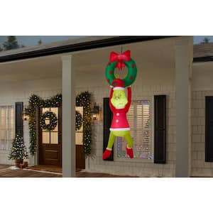 6.5 ft. LED Grinch Hanging from Wreath Christmas Airblown® Inflatable