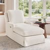 White adjustable chaise lounge near a wooden side table.