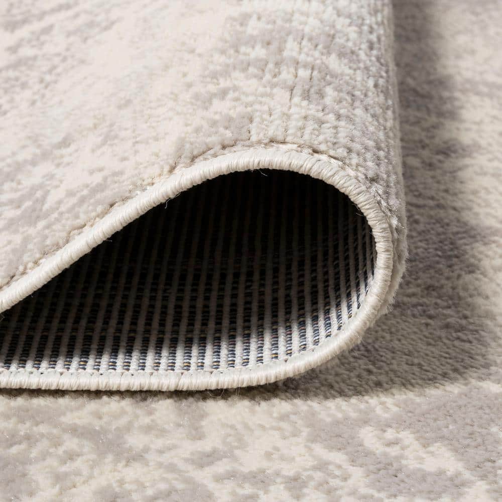 Ivory Synthetic 8' x 10' Reversible Rectangular Area Rug