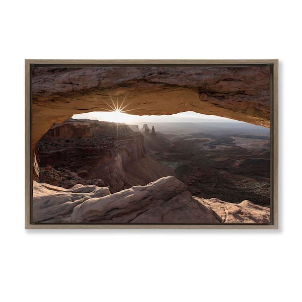 Stupell Industries Peeking Through Desert Arch by Danita Delimont Brown Floater Frame Nature Graphic Art Print 17 in. x 25 in.