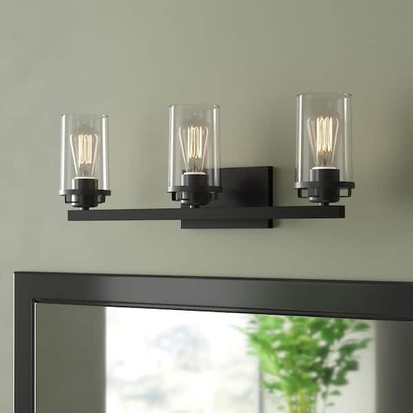 Jedrek 24 in. 3-Light Black Industrial Vanity Light with Clear Glass Shades