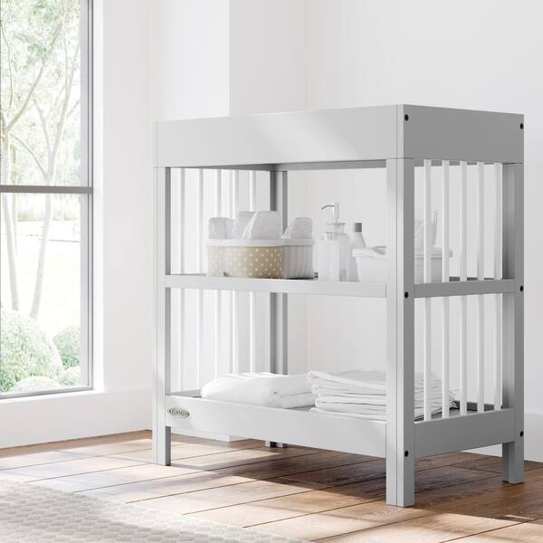 https://images.thdstatic.com/productImages/082eed7f-1d50-41e8-a1a8-656ba00043a7/svn/pebble-gray-graco-changing-tables-00524-211f-e1_600.jpg