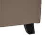Close-up of the upholstered side panel and base of the bed frame.