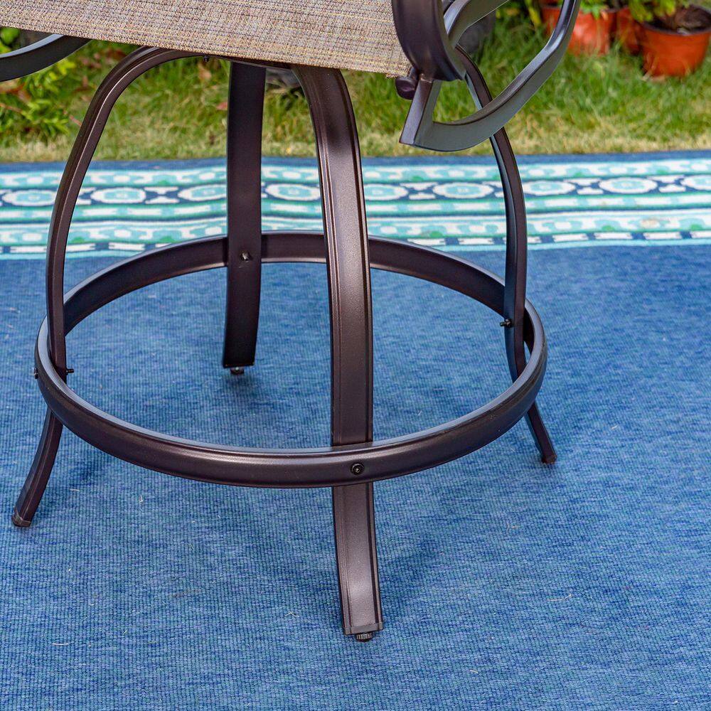 Detail view of the circular footrest on a black metal swivel bistro chair.