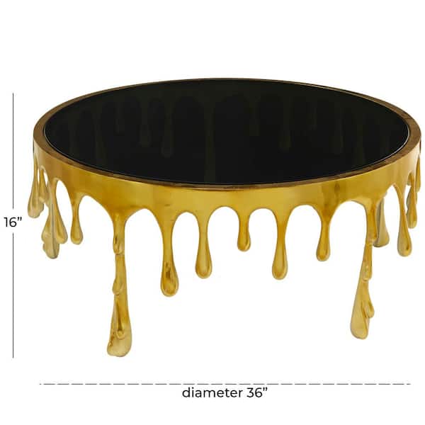 36 in. Gold Medium Round Aluminum Drip Coffee Table with Melting Designed Legs and Shaded Glass Top