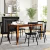 Dining table in a well-decorated, bright living space.