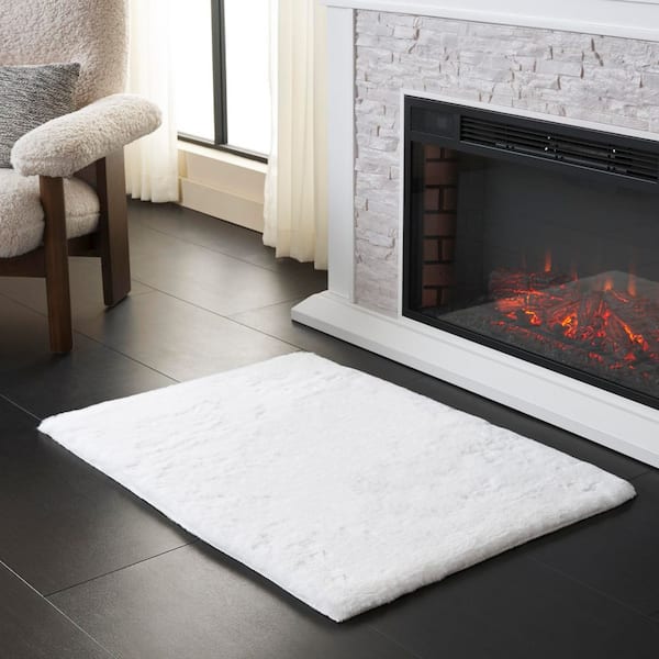 Faux Sheep Skin 2 ft. x 3 ft. Ivory Flokati Solid Area Rug