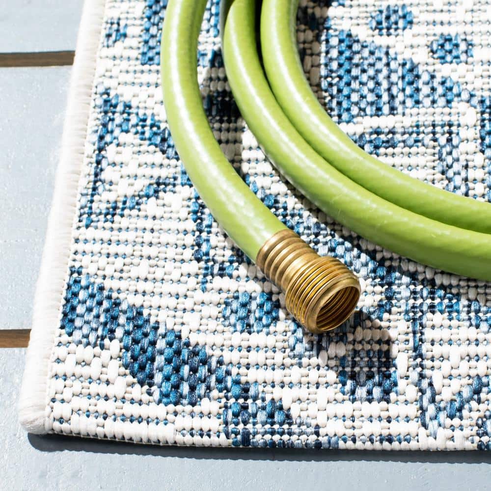 Ivory and Navy Geometric Round Synthetic Area Rug