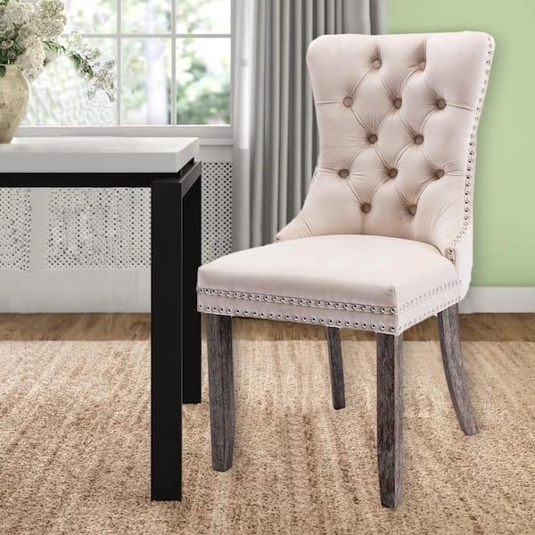 beige tufted dining chairs