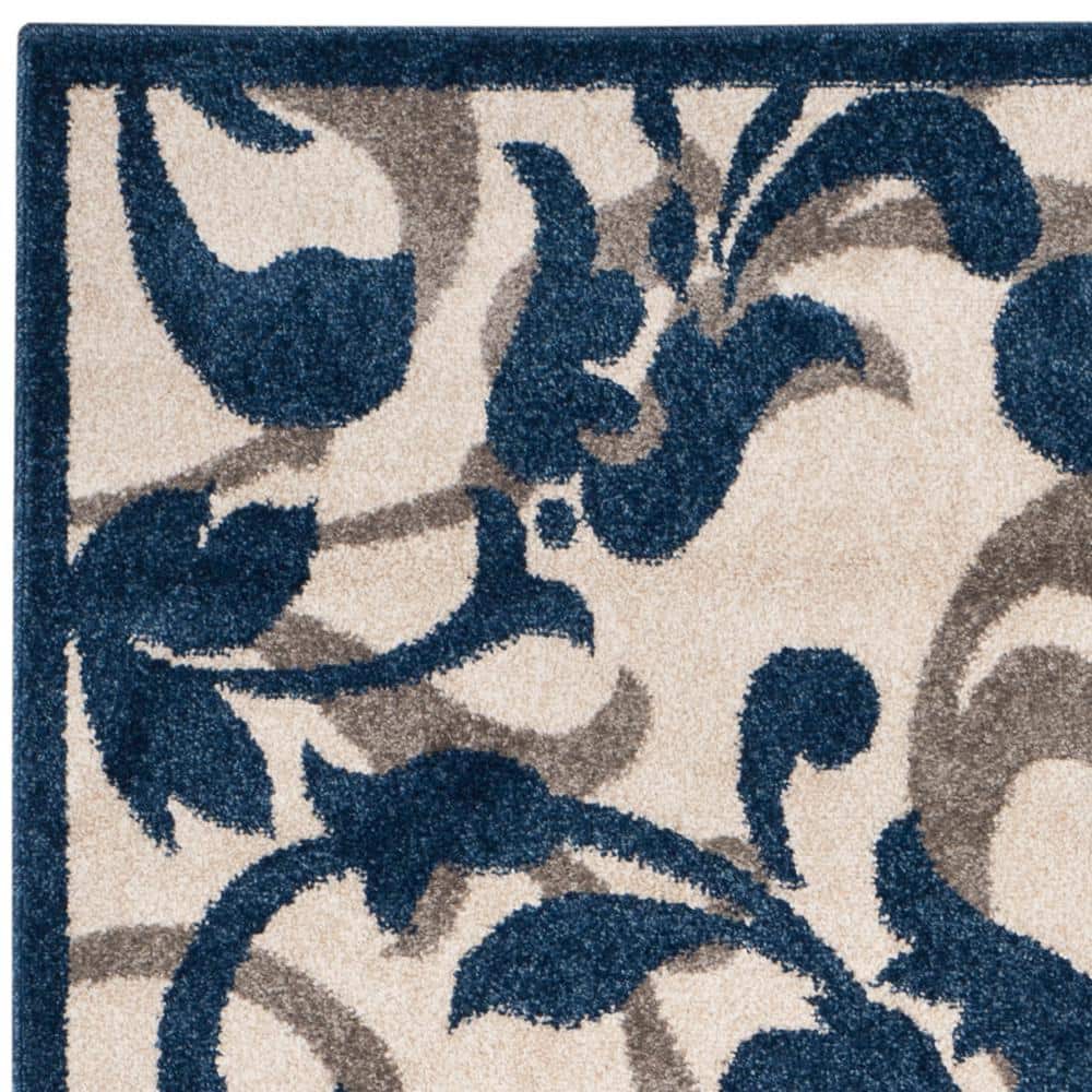 Elegant Ivory Floral Round Synthetic 6' x 9' Area Rug