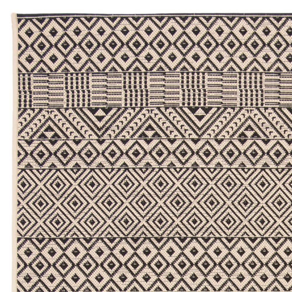 Beige and Black 9' x 12' Synthetic Flat Woven Reversible Rug