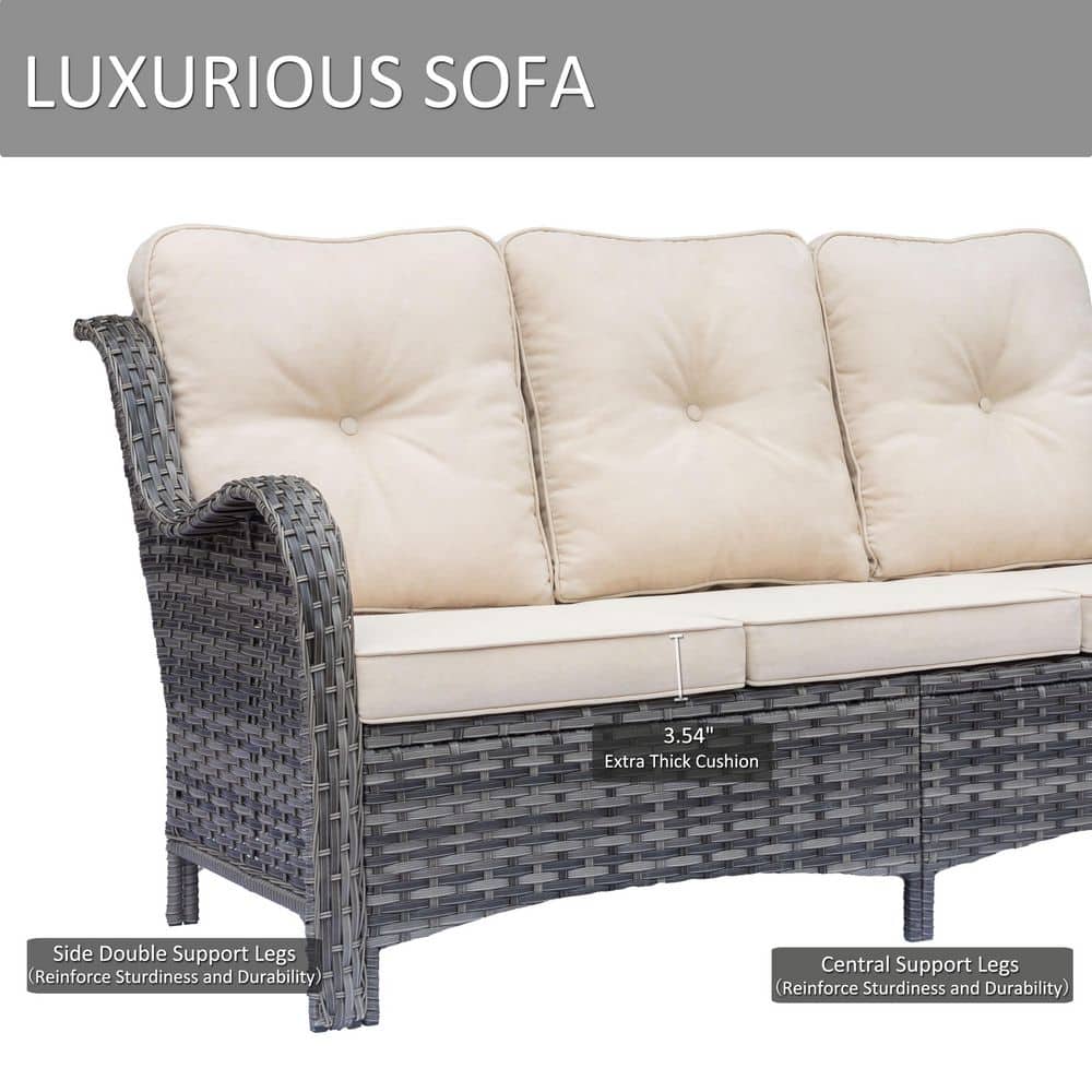 Close-up of the gray wicker sofa frame and beige cushions highlighting support legs.
