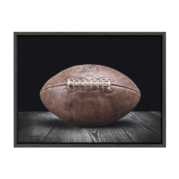 Sylvie "Vintage Football on Black" by Saint and Sailor Studios 24 in. x 18 in. Framed Canvas Wall Art