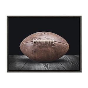 Sylvie "Vintage Football on Black" by Saint and Sailor Studios 24 in. x 18 in. Framed Canvas Wall Art