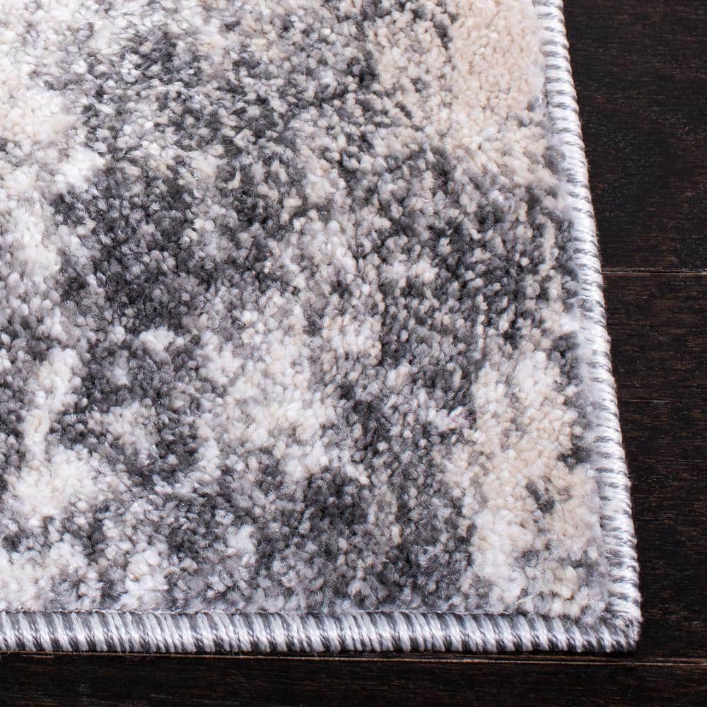 Ivory and Grey Abstract 8' x 10' Synthetic Area Rug