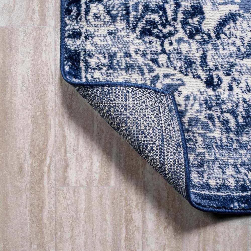 Navy and Ivory Synthetic Medallion 4' x 6' Area Rug