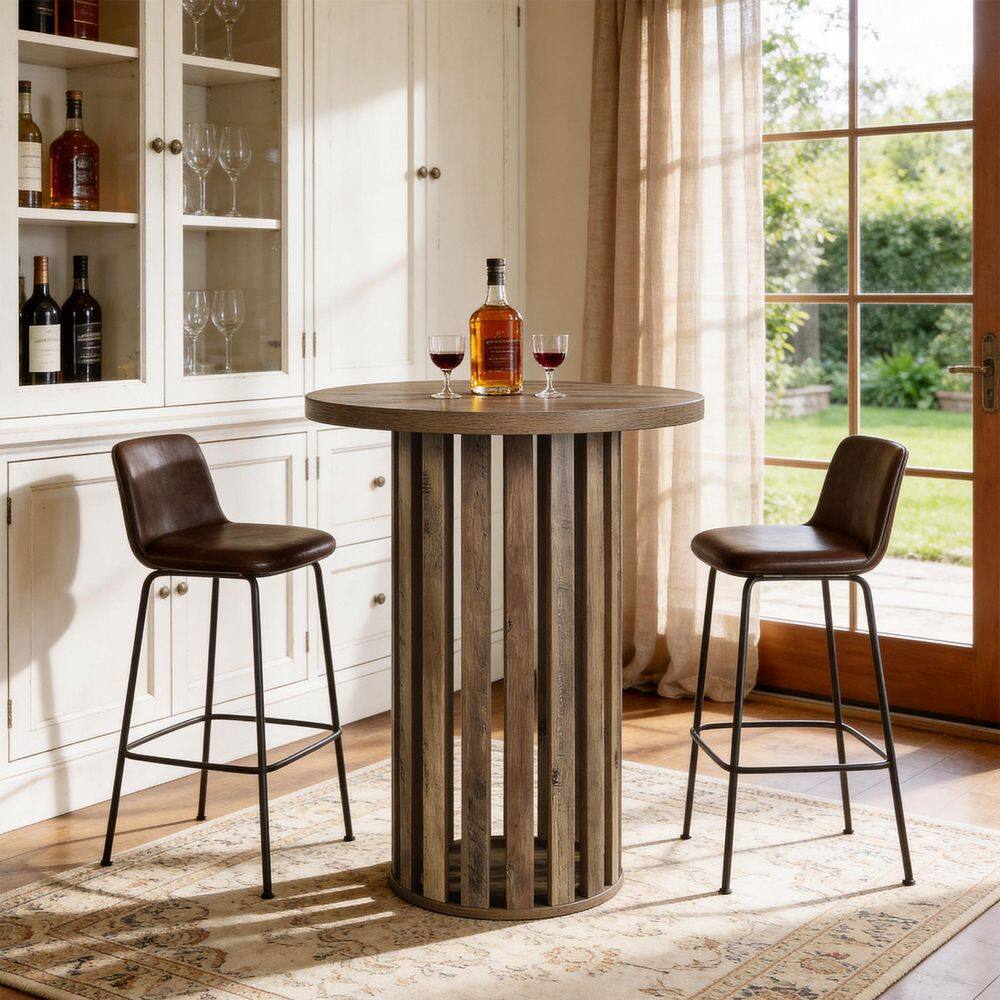 Round wooden bar table with two bar stools in a bright room.
