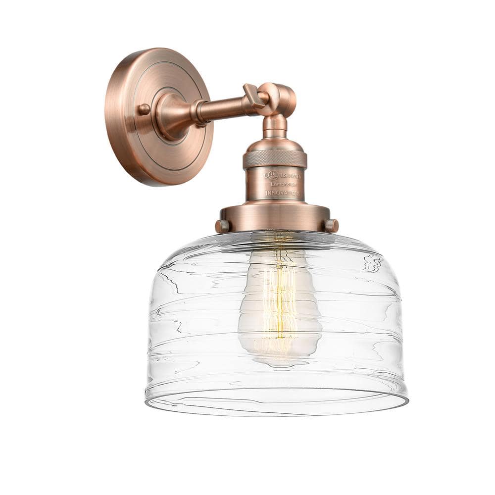 Bell 1-Light Antique Copper, Clear Deco Swirl Wall Sconce with Clear Glass Shade price history on PriceWatchPro