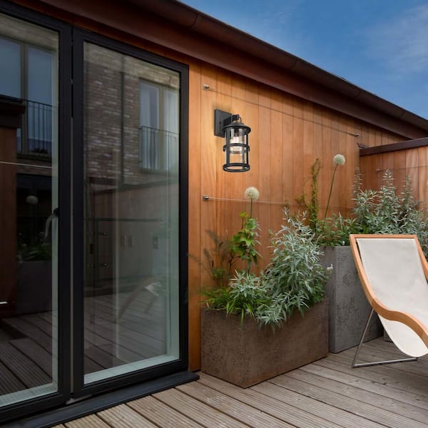 Penelope Matte Black Modern Indoor/Outdoor 1-Light Wall Sconce with Seeded Glass Shade