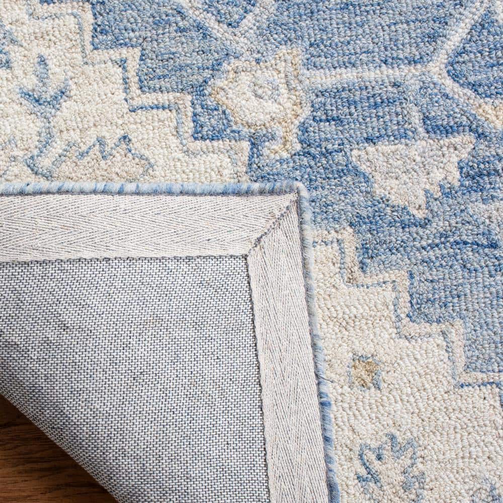 Handmade Blue and Ivory Wool 4' x 6' Tufted Area Rug
