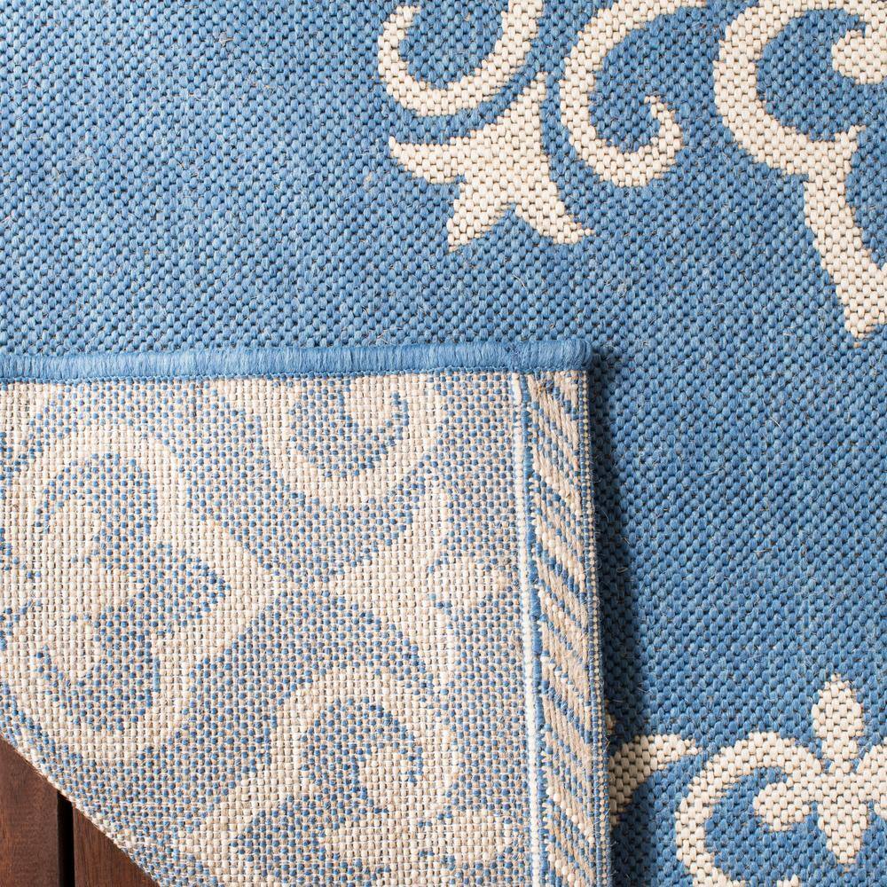 Cream and Blue Medallion Synthetic 8' x 10' Reversible Area Rug