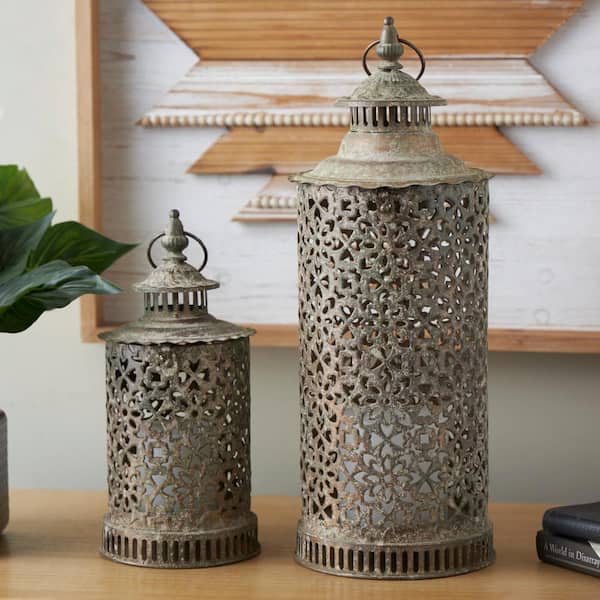 Litton Lane Brown Metal Distressed Vintage Inspired Ornate Floral Candle Lantern Set of 2