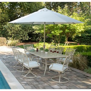 Traditions 9-Piece Aluminum Outdoor Dining Set with 8 Swivel Rockers, Umbrella and Cast Table with Beige Cushions