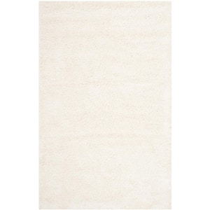 Milan Shag Ivory 10 ft. x 14 ft. Solid Area Rug