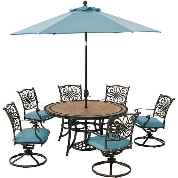 Hanover Monaco 7-Piece Aluminum Outdoor Dining Set with Blue Cushions, 6 Swivel Rockers, Tile-Top Table and 9 ft. Umbrella
