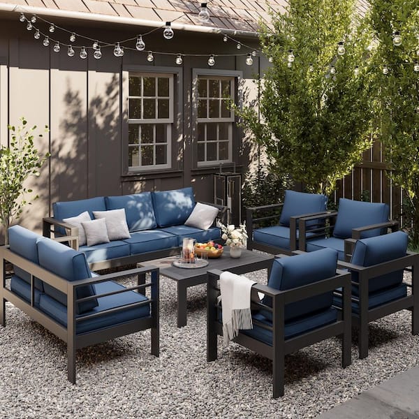 7-Piece Black Aluminum Patio Conversation Set with Blue Cushions and Coffee Table