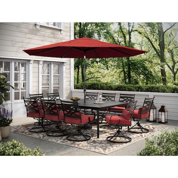 Hanover Montclair 11-Piece Steel Outdoor Dining Set with Chili Red Cushions, 10 Swivel Rockers, 60x84 in. Table and Umbrella