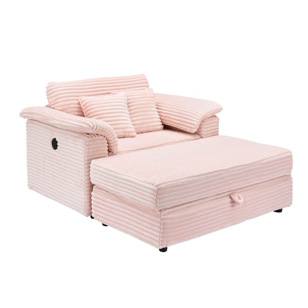 Pink corduroy sofa with back cushions and storage drawer, side view.