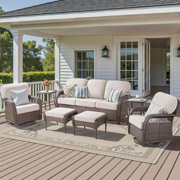 7-Piece Wicker Swivel Patio Conversation Set Including Sofa, Swivel Chairs, Footstools, and Table with Beige Cushions