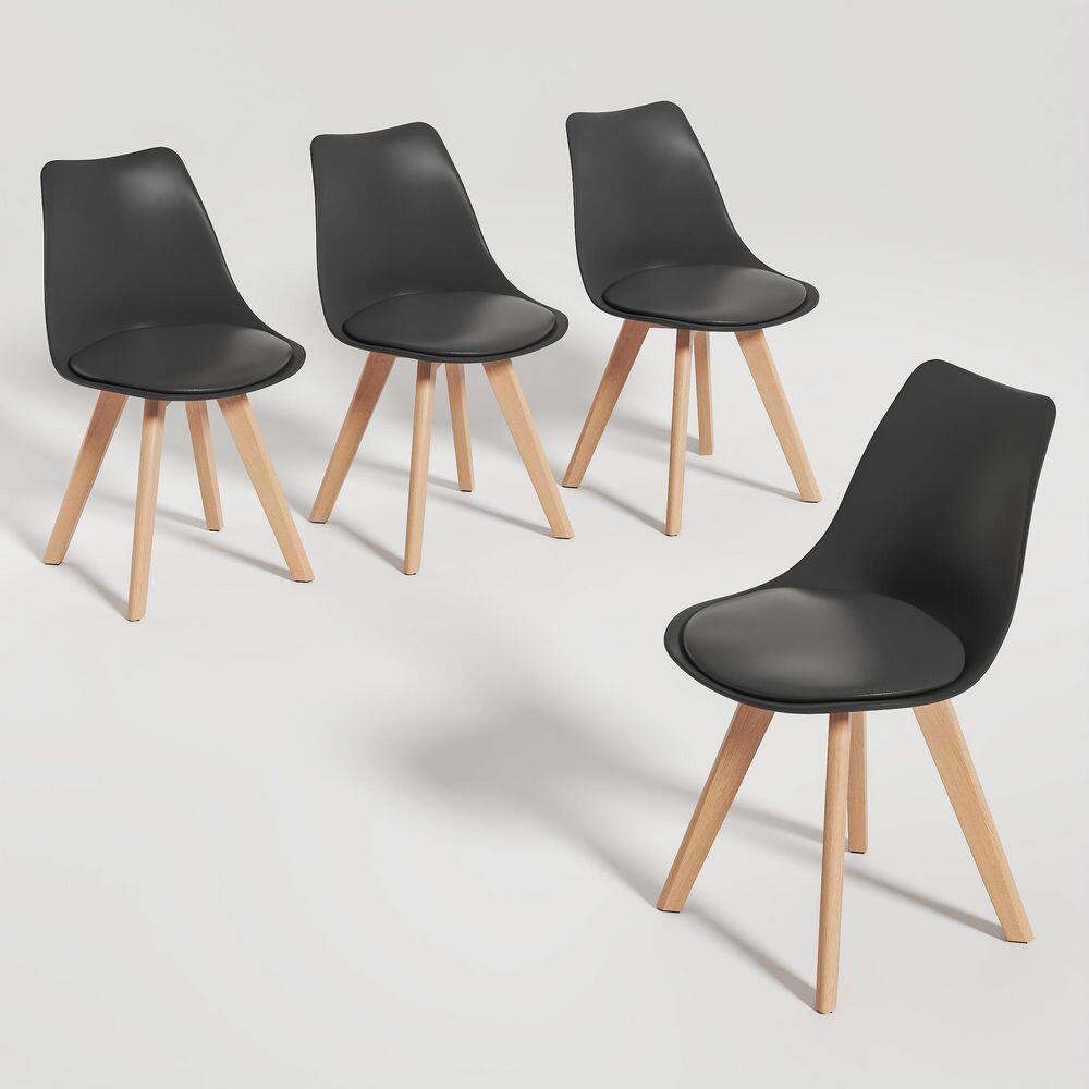 Four black modern dining chairs on a plain background.