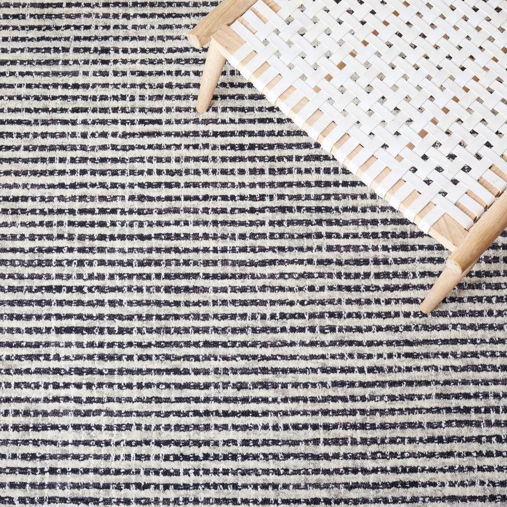 Handmade Black and Ivory Abstract Wool Area Rug, 5' x 8'
