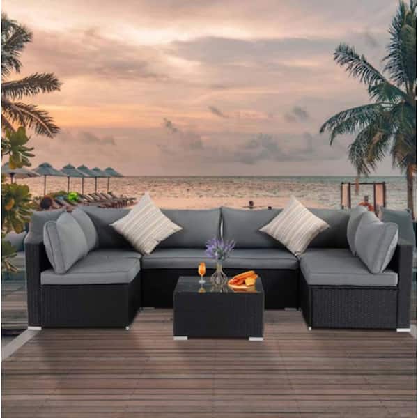 7-Piece Black Wicker Outdoor Sectional Sofa Set with Gray Cushions and Ottomans