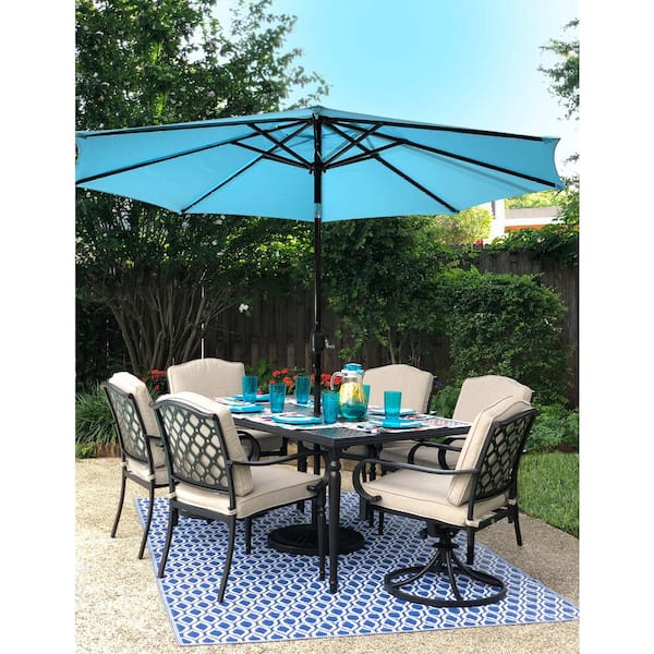 patio set with lighted umbrella