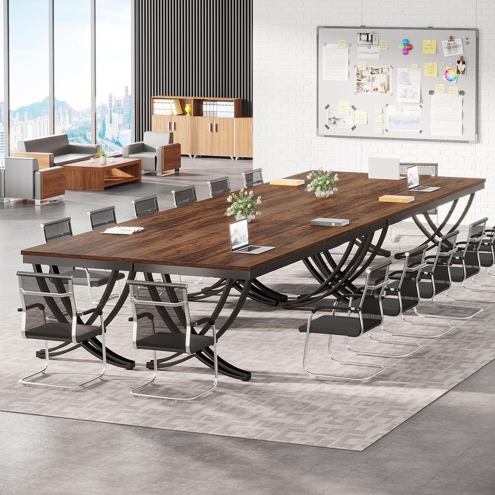 Moronia brown wooden conference table with black chairs in a modern office.