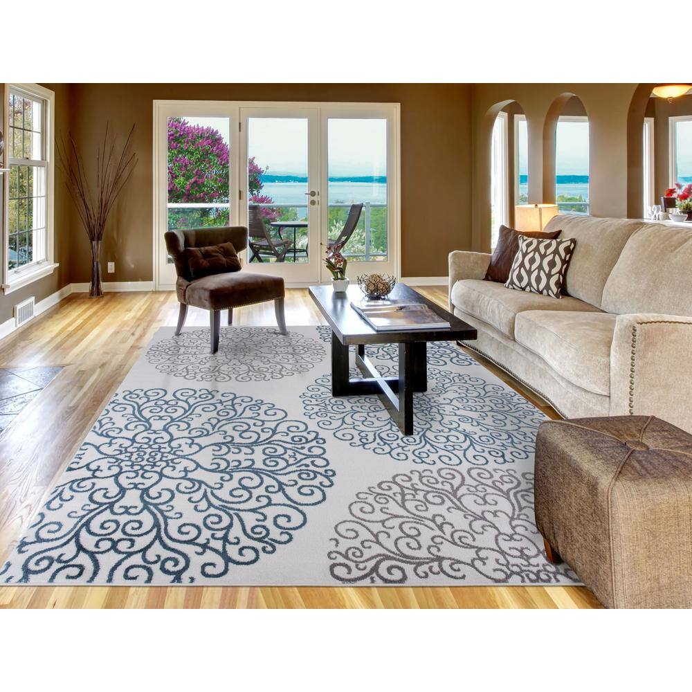 Ivory Elegance 5'3" x 7'3" Synthetic Medallion Area Rug